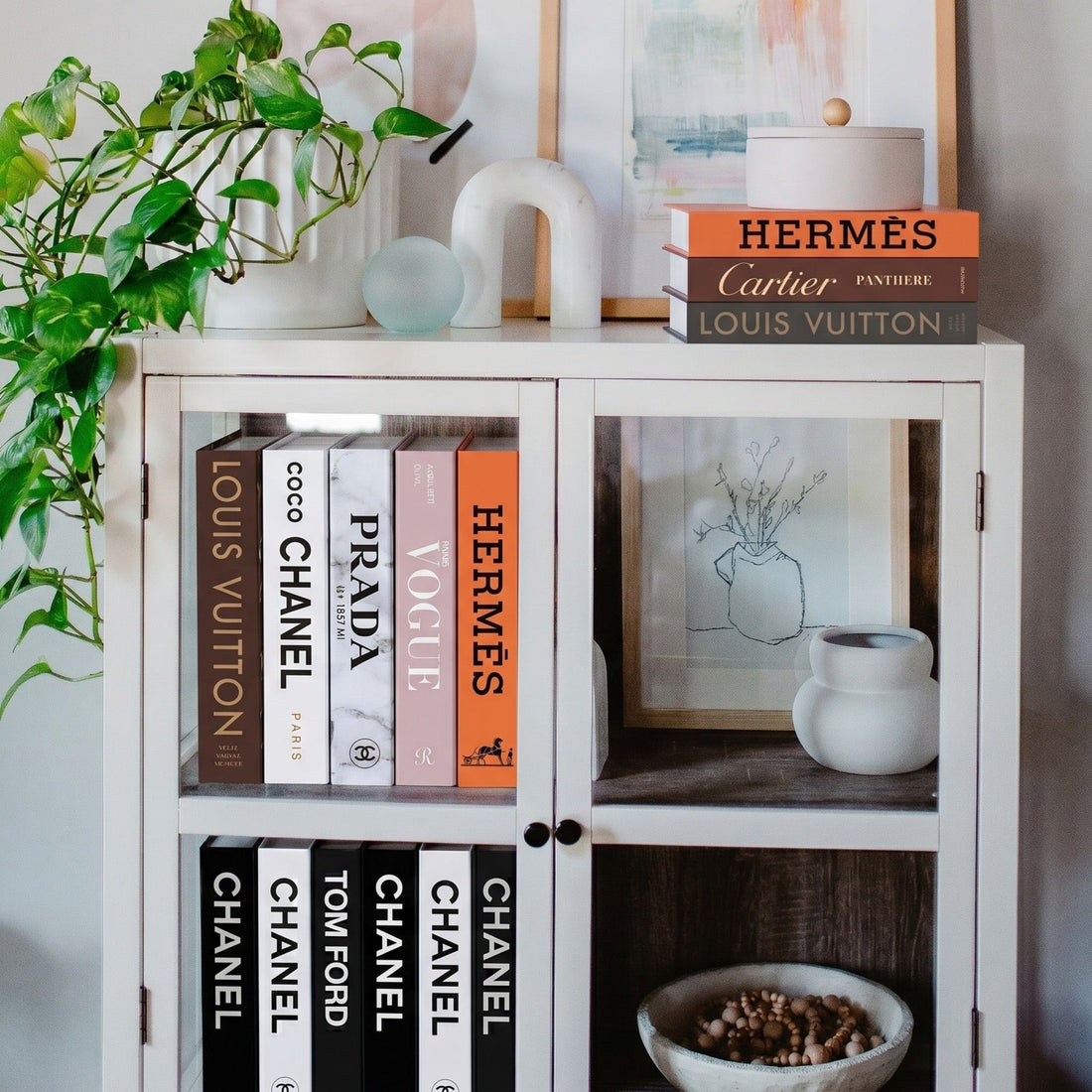 5 Shelf Styling Ideas for a Calm, Neutral Home — Decorative books styled on a shelf with greenery