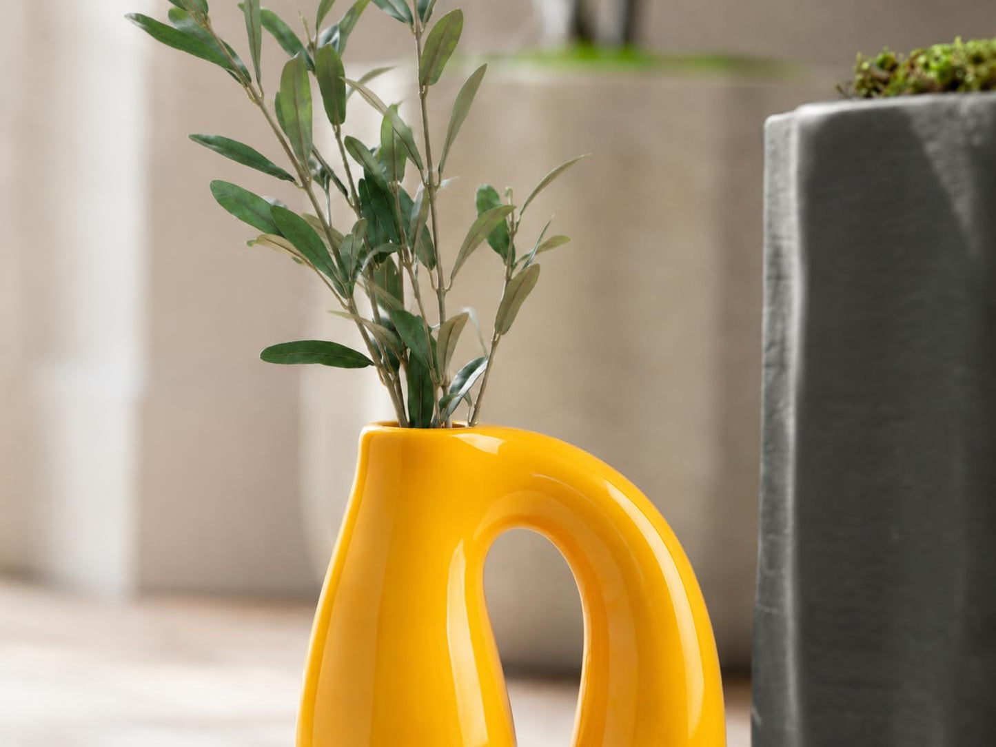 Yellow vase styled with tulips
